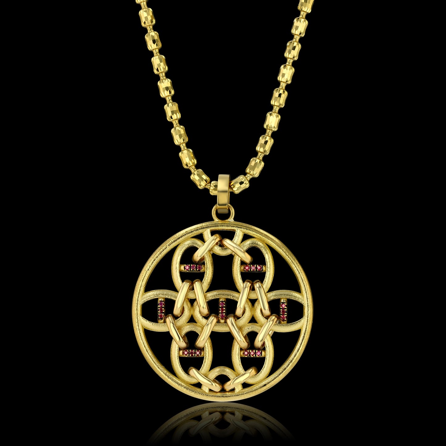 Round pendant, with geometrically placed horse bit shapes encrusted with diamonds on one side and rubies on the other, on an 18k yellow gold necklace.